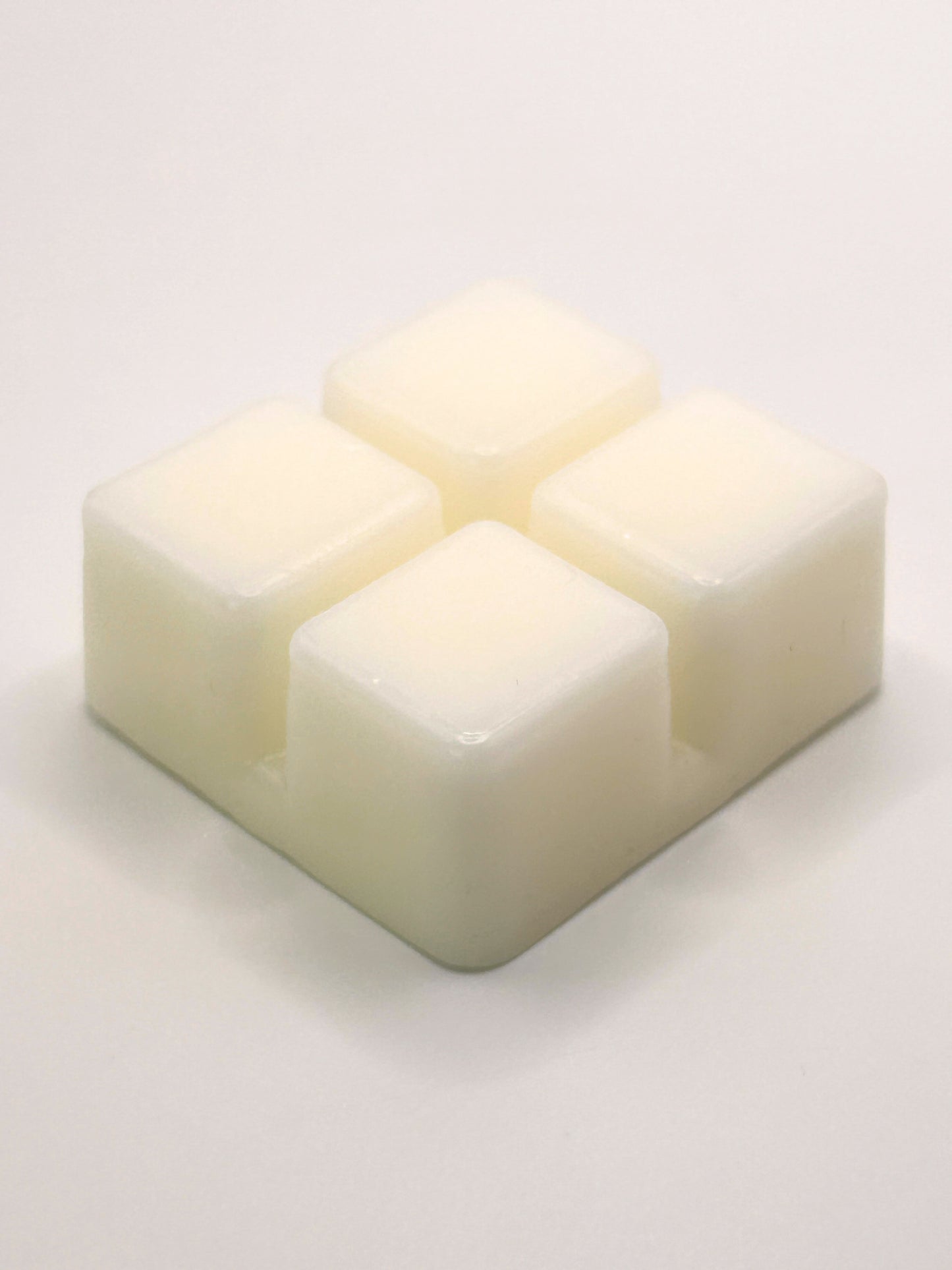 Angled close up of Cedarwood & Amber 60g wax melt bar showing the smooth wax surface from the Hellomelts Autumn Collection