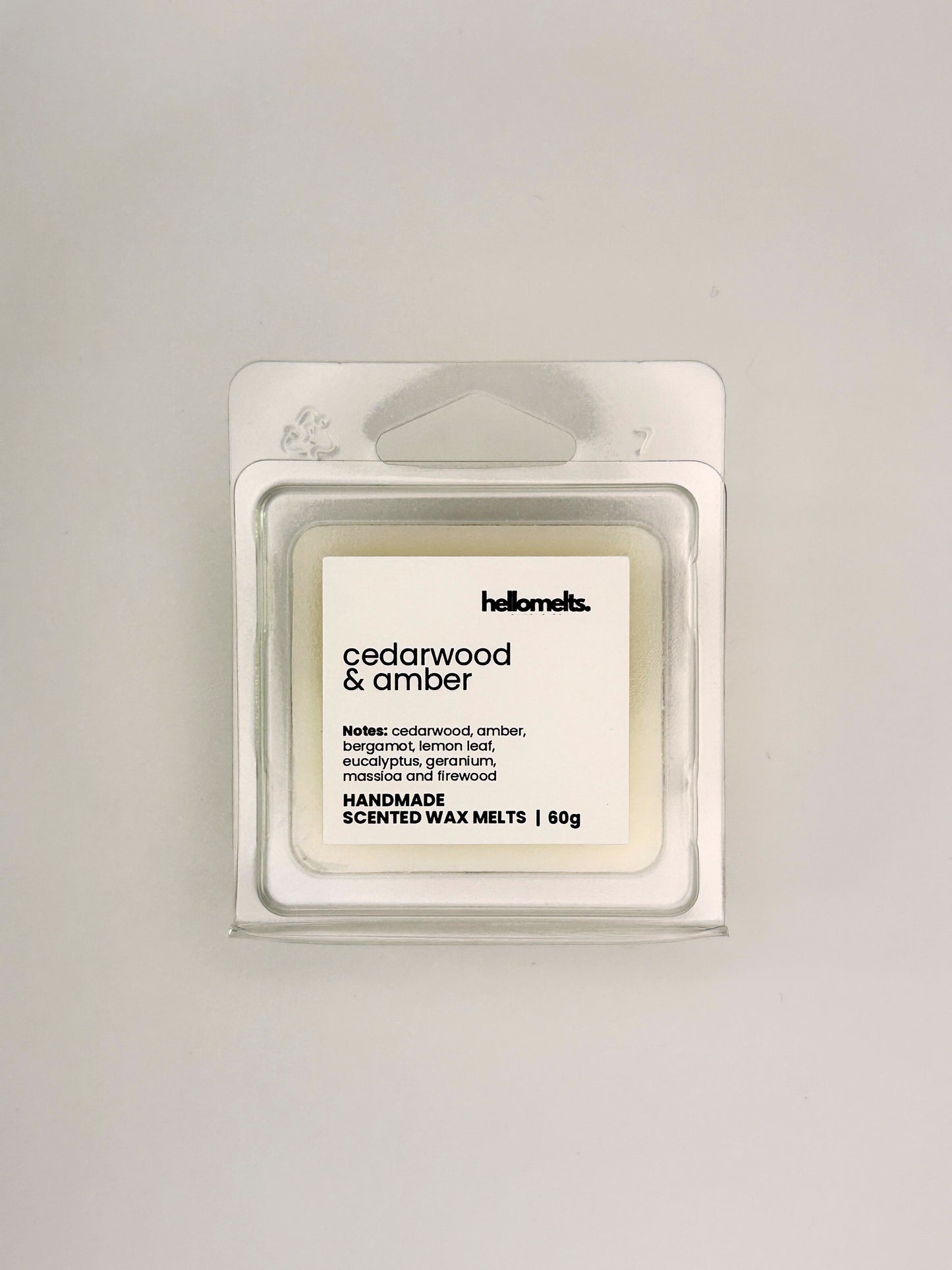 Front view of Cedarwood & Amber 60g wax melt in clear clamshell packaging from the Hellomelts Autumn Collection