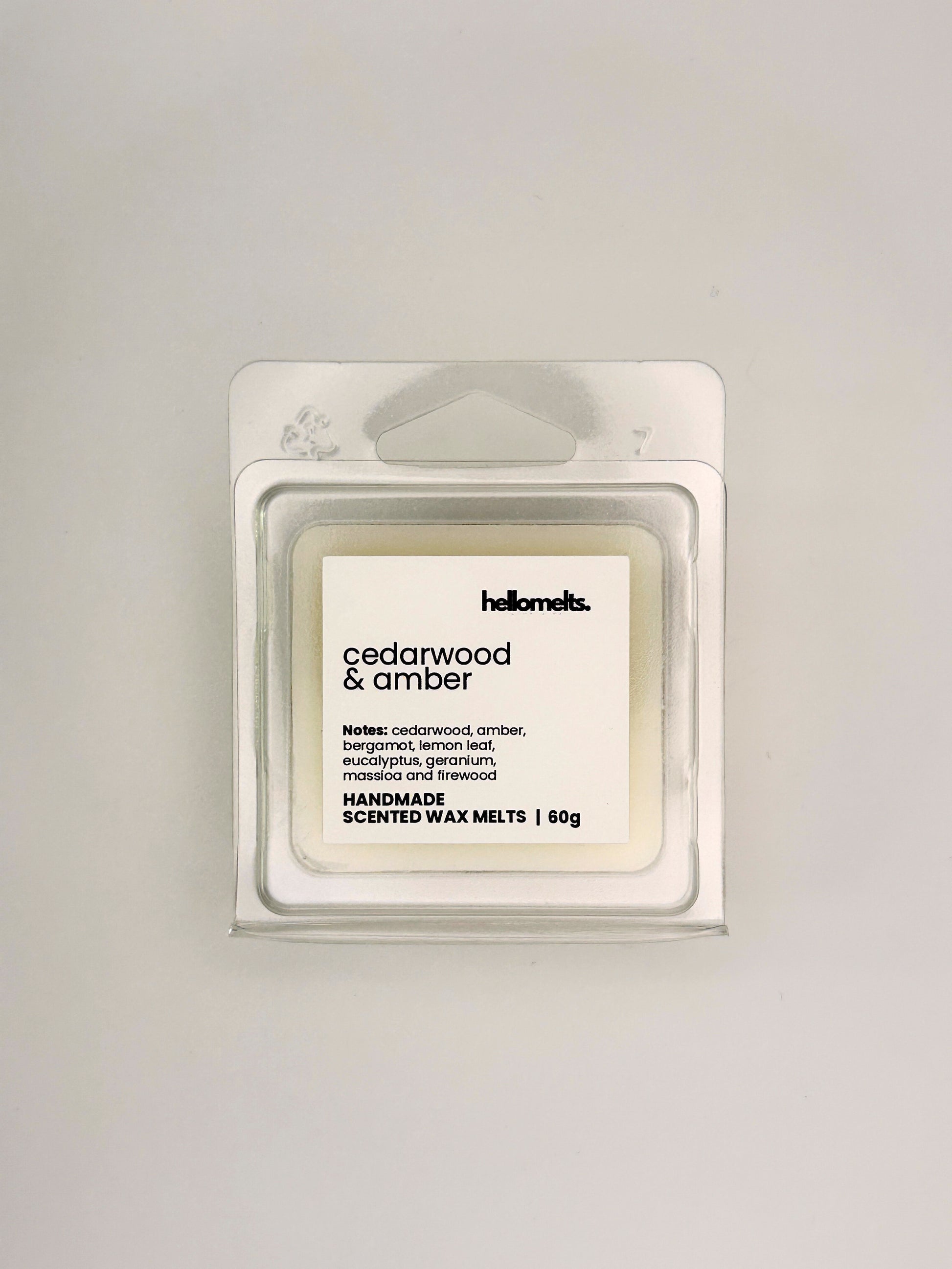 Front view of Cedarwood & Amber 60g wax melt in clear clamshell packaging from the Hellomelts Autumn Collection