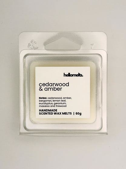 Close up of Cedarwood & Amber 60g wax melt label on clear clamshell packaging from the Hellomelts Autumn Collection