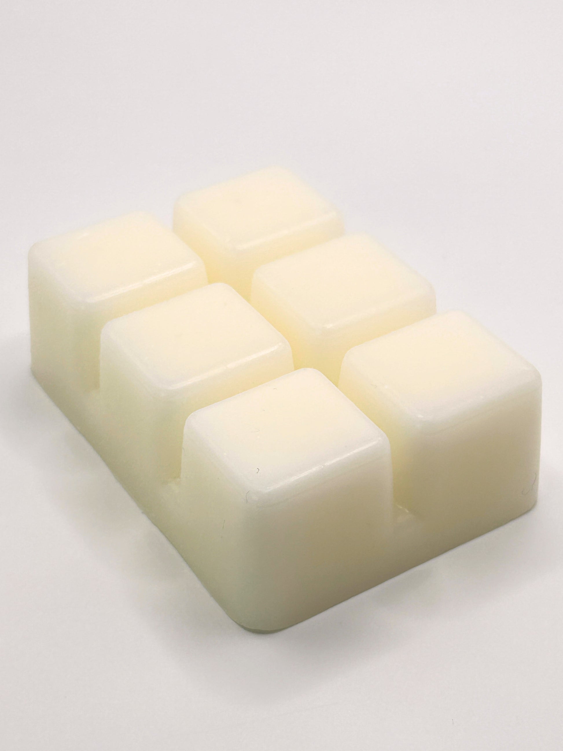 Angled close up of Cedarwood & Amber 85g wax melt bar showing the smooth wax surface from the Hellomelts Autumn Collection