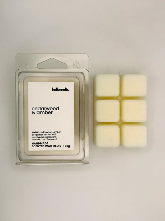 Cedarwood & Amber 85g wax melt bar displayed beside its clear clamshell packaging from the Hellomelts Autumn Collection