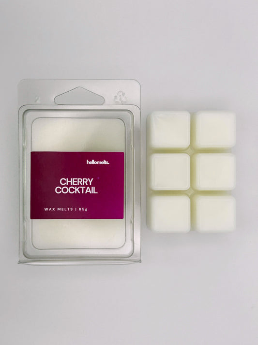 Cherry Cocktail 85g wax melt bar by Hellomelts pictured beside its clamshell packaging, part of the Summer Collection
