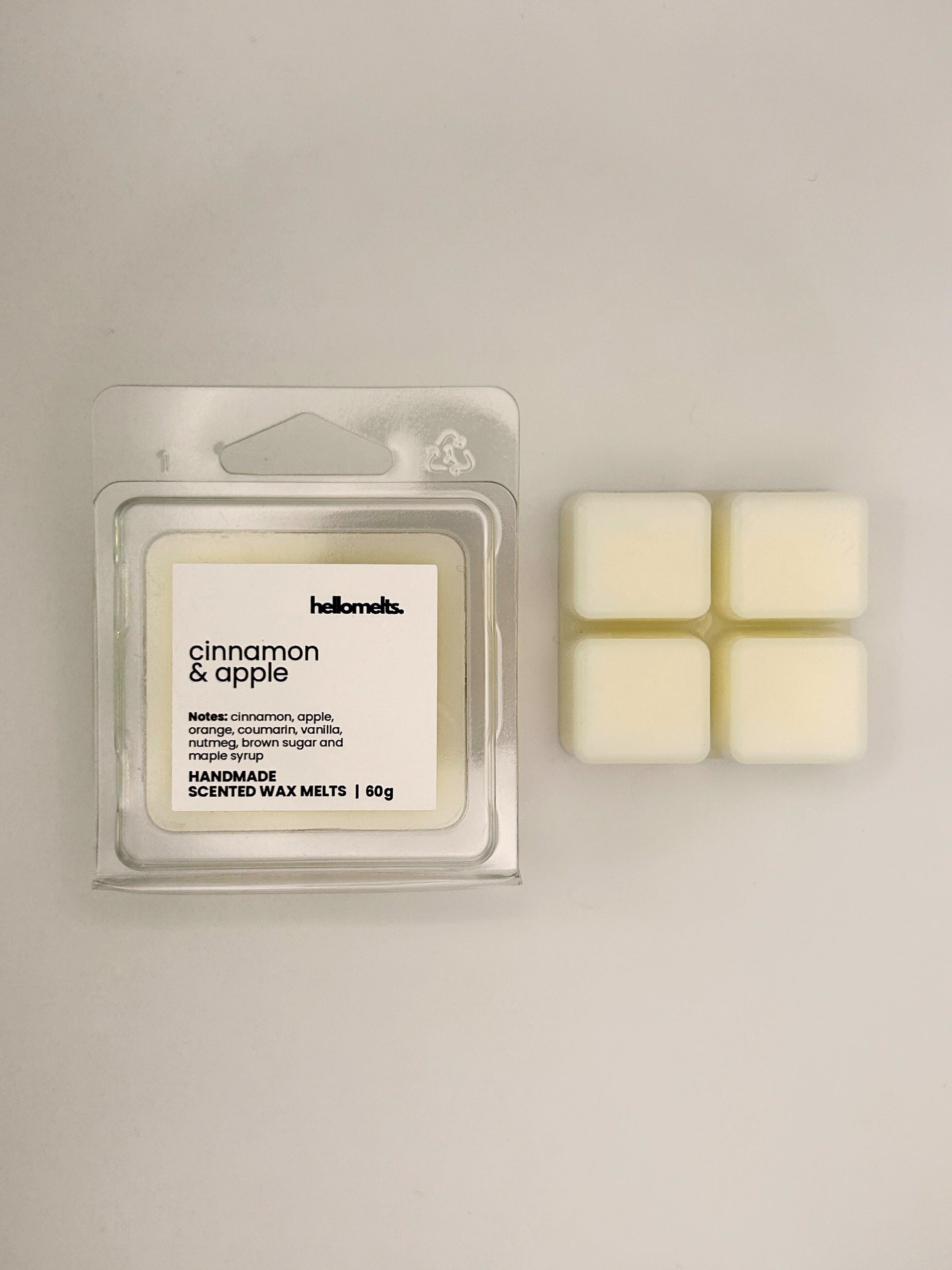 Cinnamon & Apple 60g wax melt bar displayed beside its clear clamshell packaging from the Hellomelts Autumn Collection