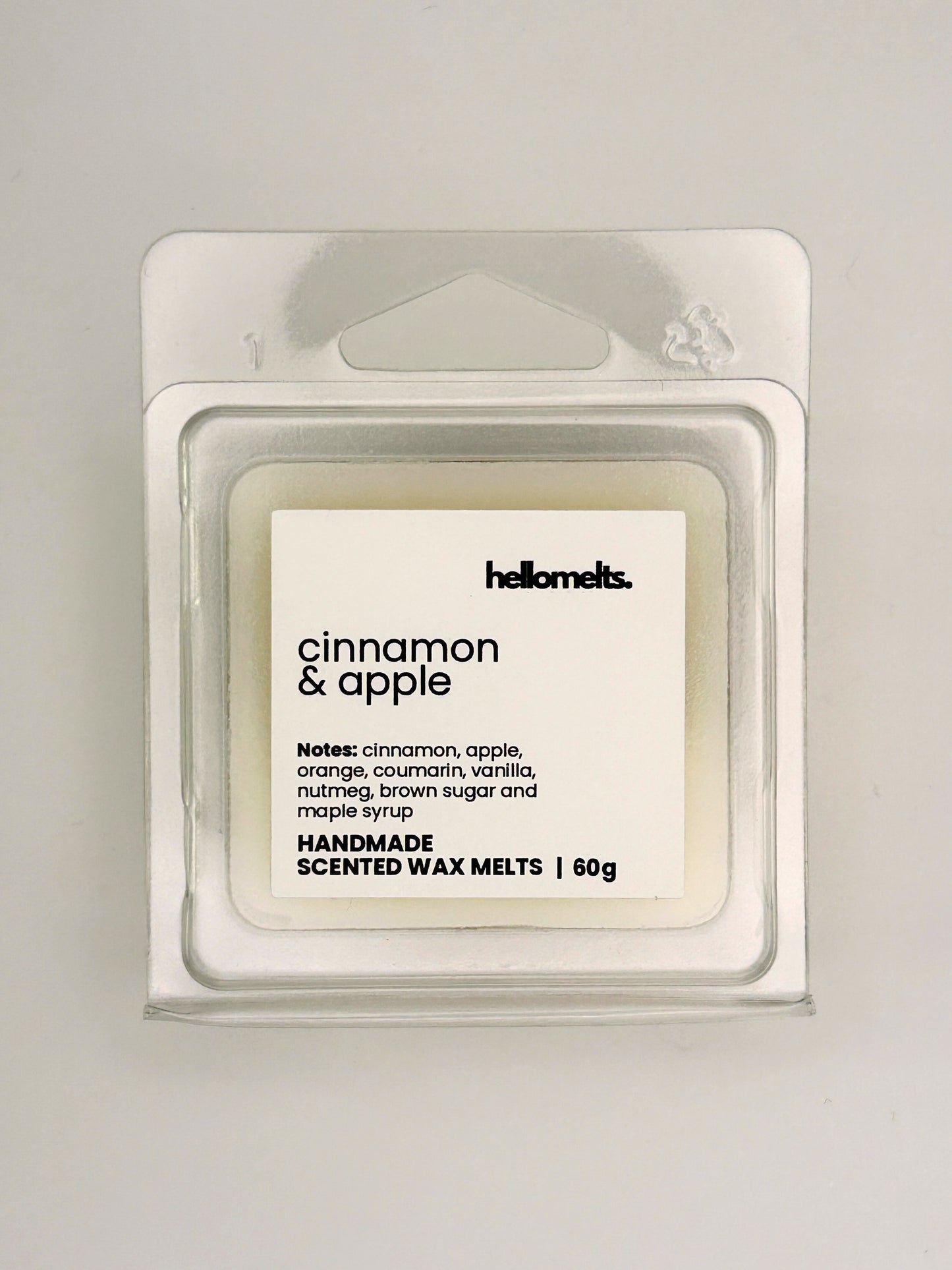 Close up of Cinnamon & Apple 60g wax melt label on clear clamshell packaging from the Hellomelts Autumn Collection