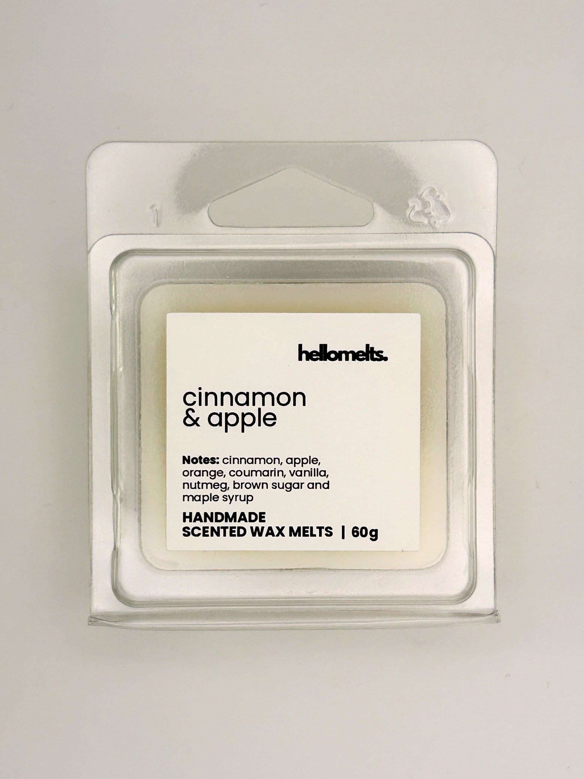 Close up of Cinnamon & Apple 60g wax melt label on clear clamshell packaging from the Hellomelts Autumn Collection