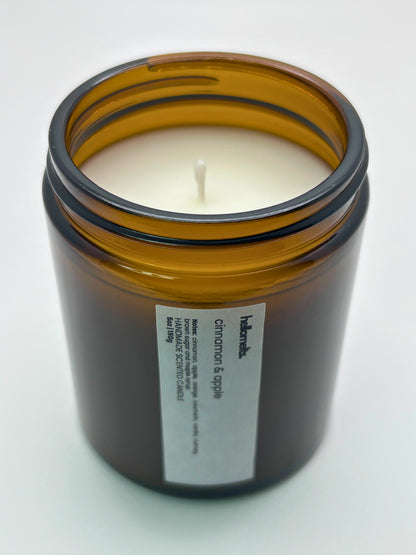 Angled top-down view of Cinnamon & Apple autumn candle by Hellomelts, highlighting the wick and hand-poured wax, part of the Autumn Collection