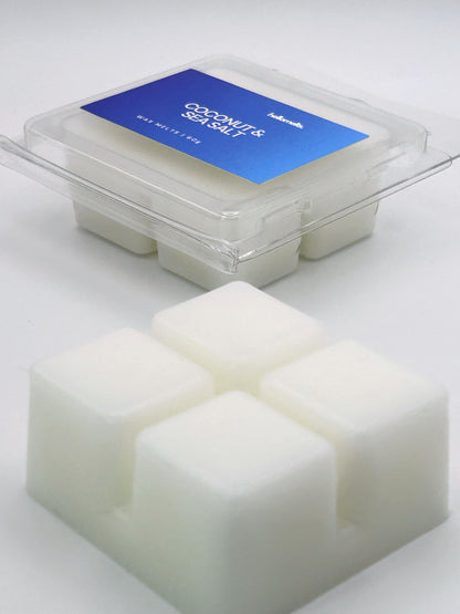 Angled shot of Coconut & Sea Salt 60g wax melt bar in front of its packaging, part of the Summer Collection by Hellomelts