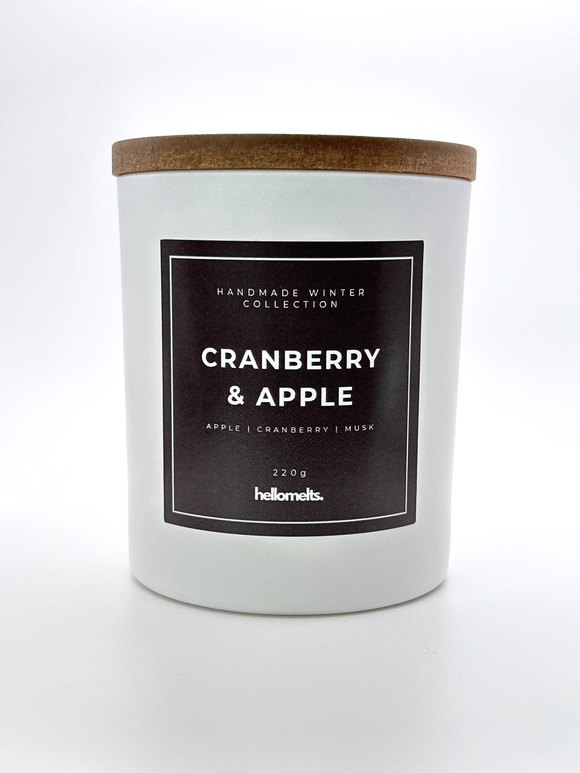 Cranberry & Apple 220g candle front-facing studio shot with wooden lid on, part of the Hellomelts Winter Collection