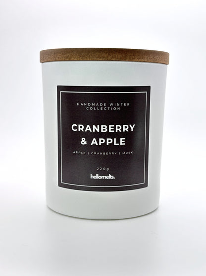 Cranberry & Apple 220g candle front-facing studio shot with wooden lid on, part of the Hellomelts Winter Collection