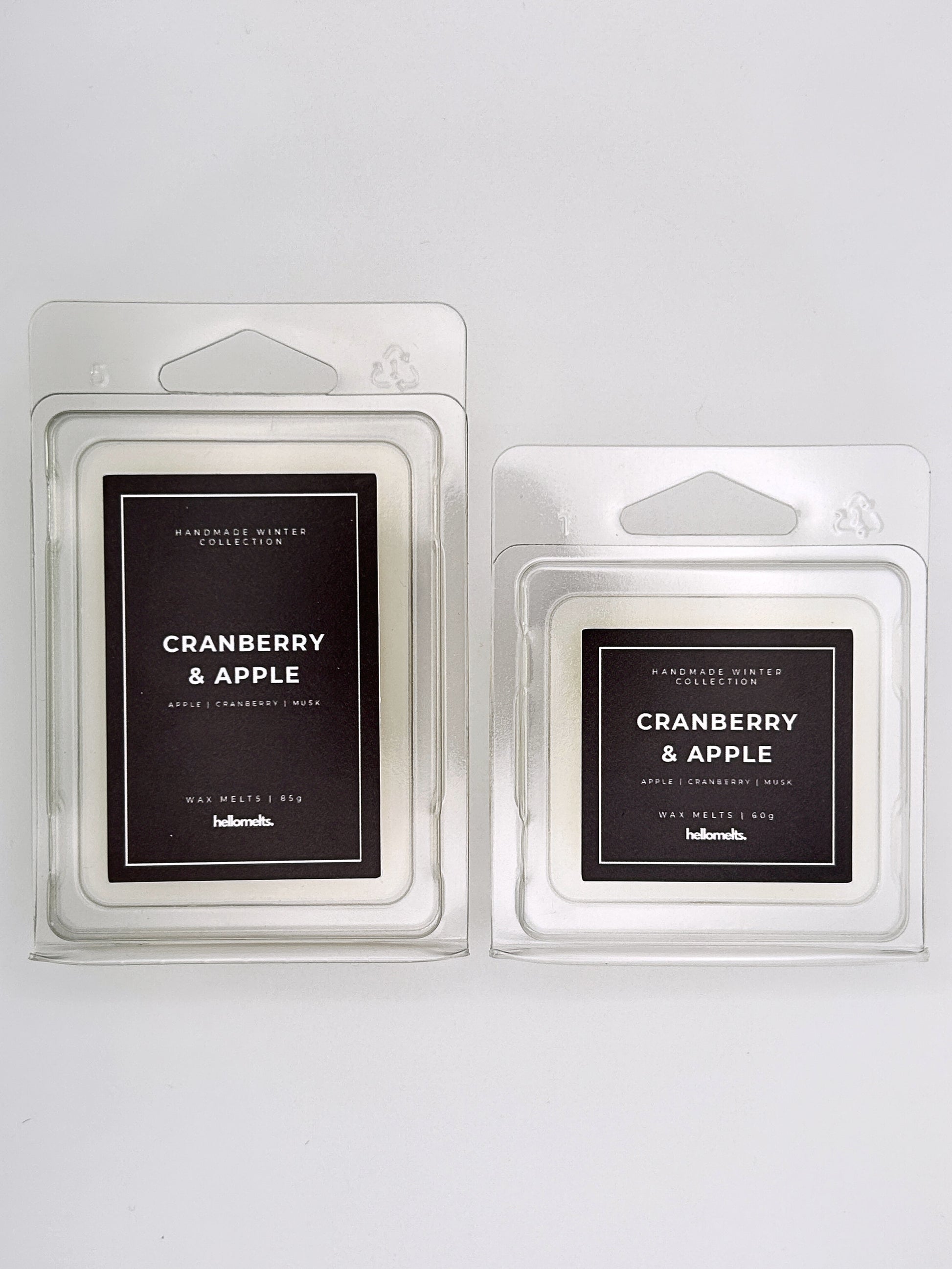 Cranberry & Apple wax melts 85g and 60g shown together as a size comparison in clamshell packaging from the Hellomelts Winter Collection