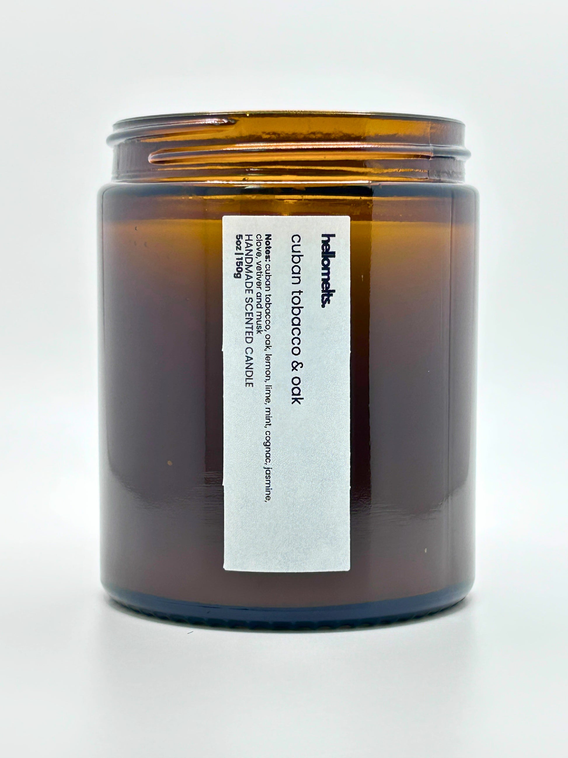 Close-up front view of Cuban Tobacco & Oak autumn scented candle by Hellomelts with the lid off, part of the Autumn Collection