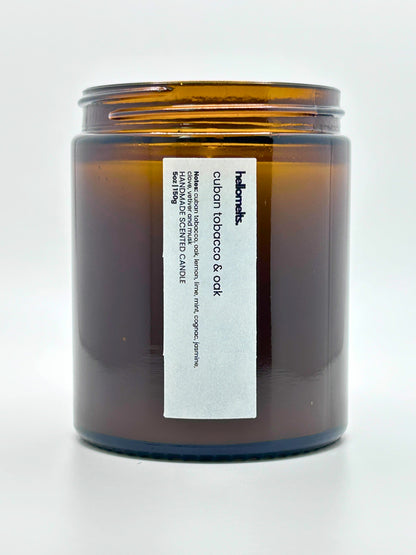 Close-up front view of Cuban Tobacco & Oak autumn scented candle by Hellomelts with the lid off, part of the Autumn Collection