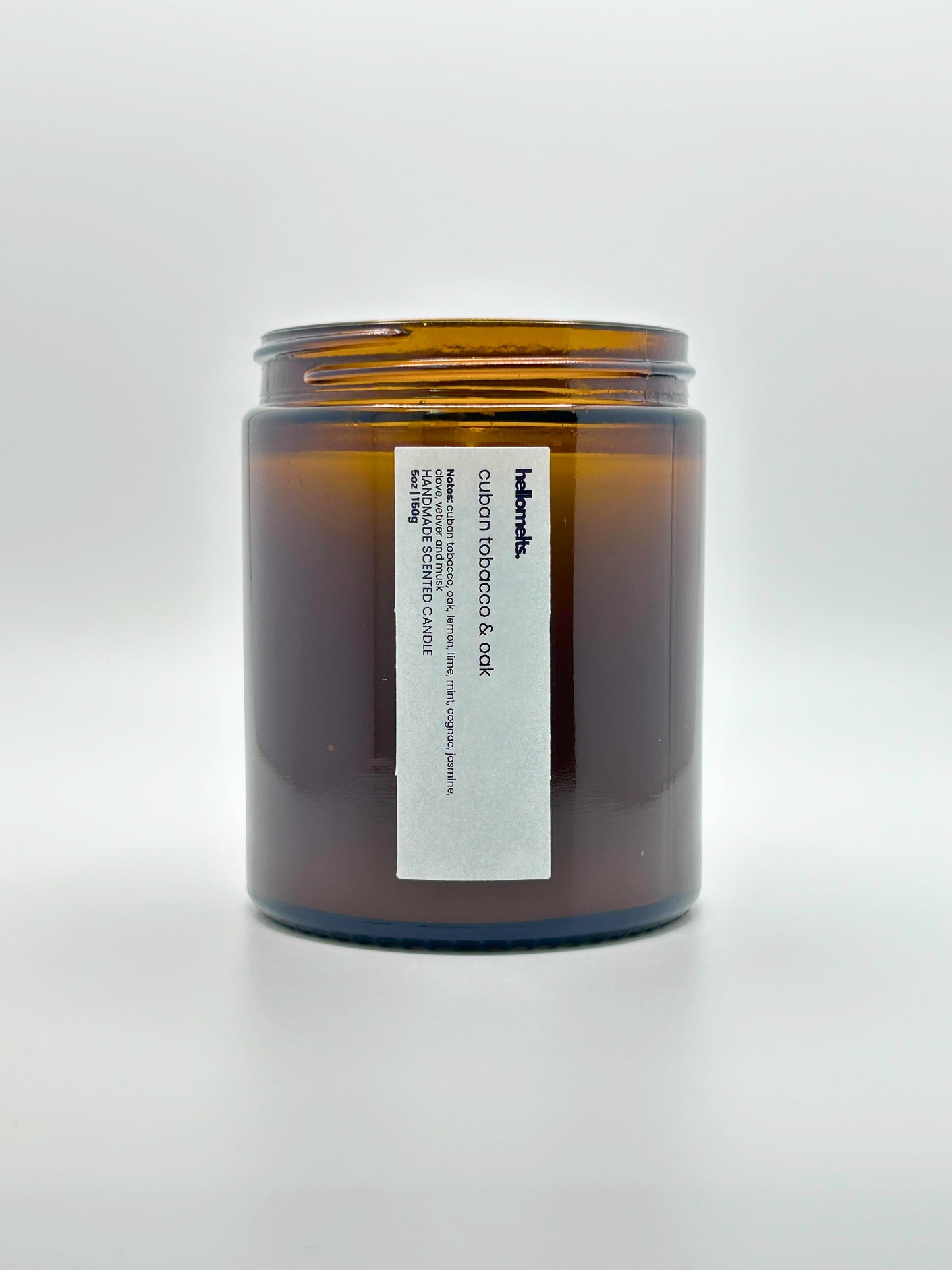 Front view of Cuban Tobacco & Oak autumn scented candle by Hellomelts with the lid off, part of the Autumn Collection