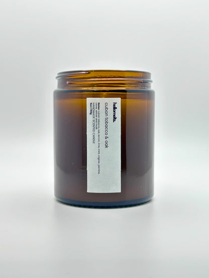 Front view of Cuban Tobacco & Oak autumn scented candle by Hellomelts with the lid off, part of the Autumn Collection