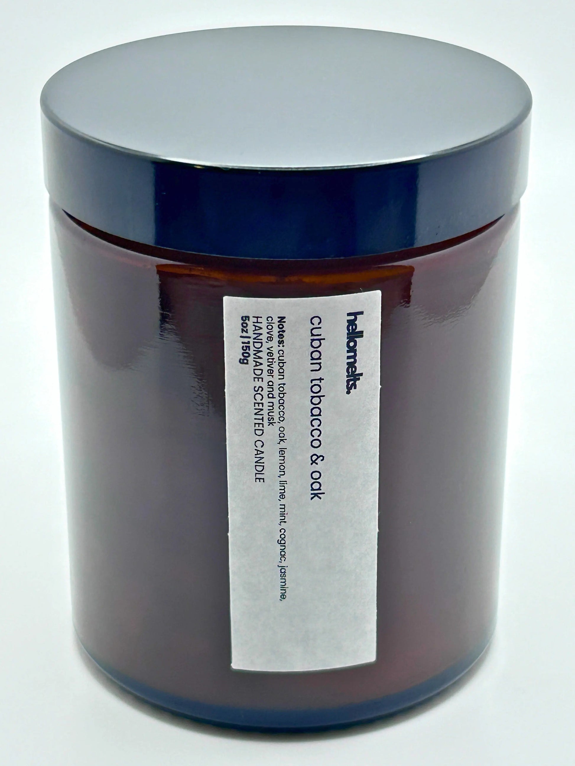 Close-up front view of Cuban Tobacco & Oak candle by Hellomelts with the lid on, part of the autumn collection.