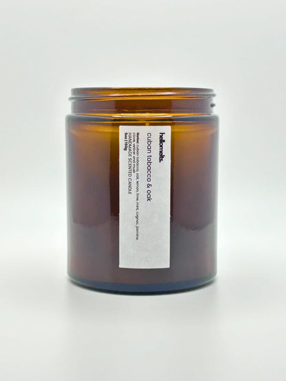 Front view of Cuban Tobacco & Oak candle by Hellomelts with the lid off, showing the hand-poured wax, from the autumn collection.
