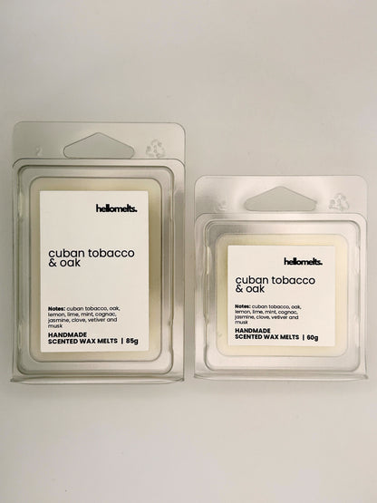 Cuban Tobacco & Oak wax melts in 60g and 85g clamshells shown side by side from the Hellomelts Autumn Collection