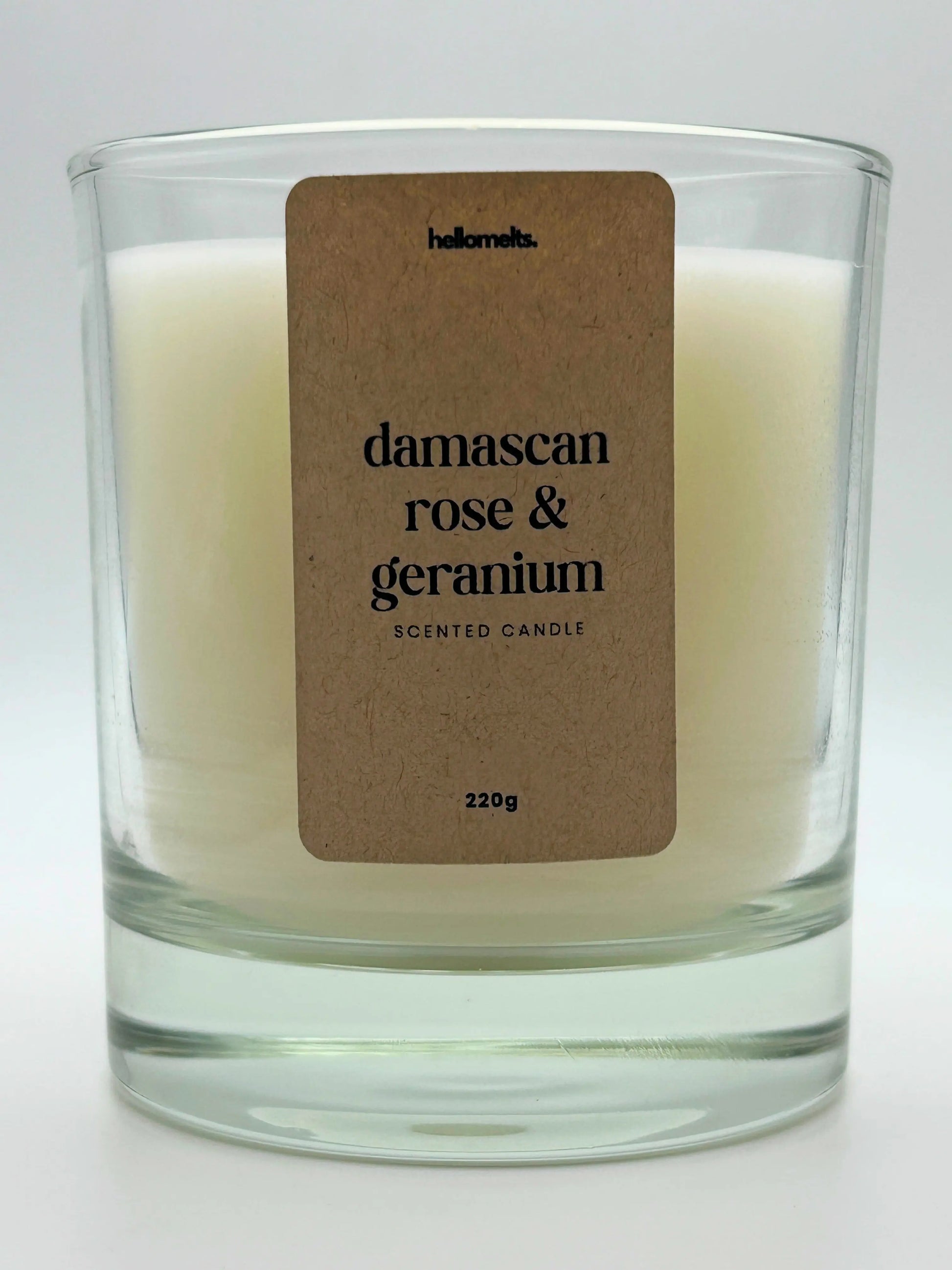 Close-up of the Damascan Rose & Geranium candle label showing scent name and weight, a handcrafted candle by Hellomelts for the Spring Collection.