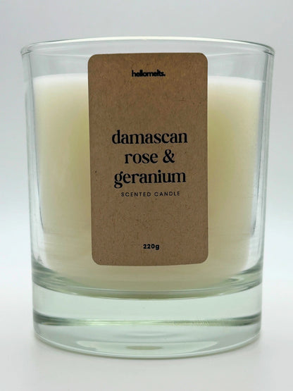 Close-up of the Damascan Rose & Geranium candle label showing scent name and weight, a handcrafted candle by Hellomelts for the Spring Collection.