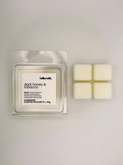 Dark Honey & Tobacco 60g wax melt bar displayed beside its clear clamshell packaging from the Hellomelts Autumn Collection