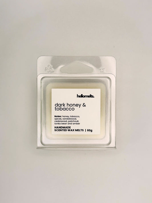 Front view of Dark Honey & Tobacco 60g wax melt in clear clamshell packaging from the Hellomelts Autumn Collection