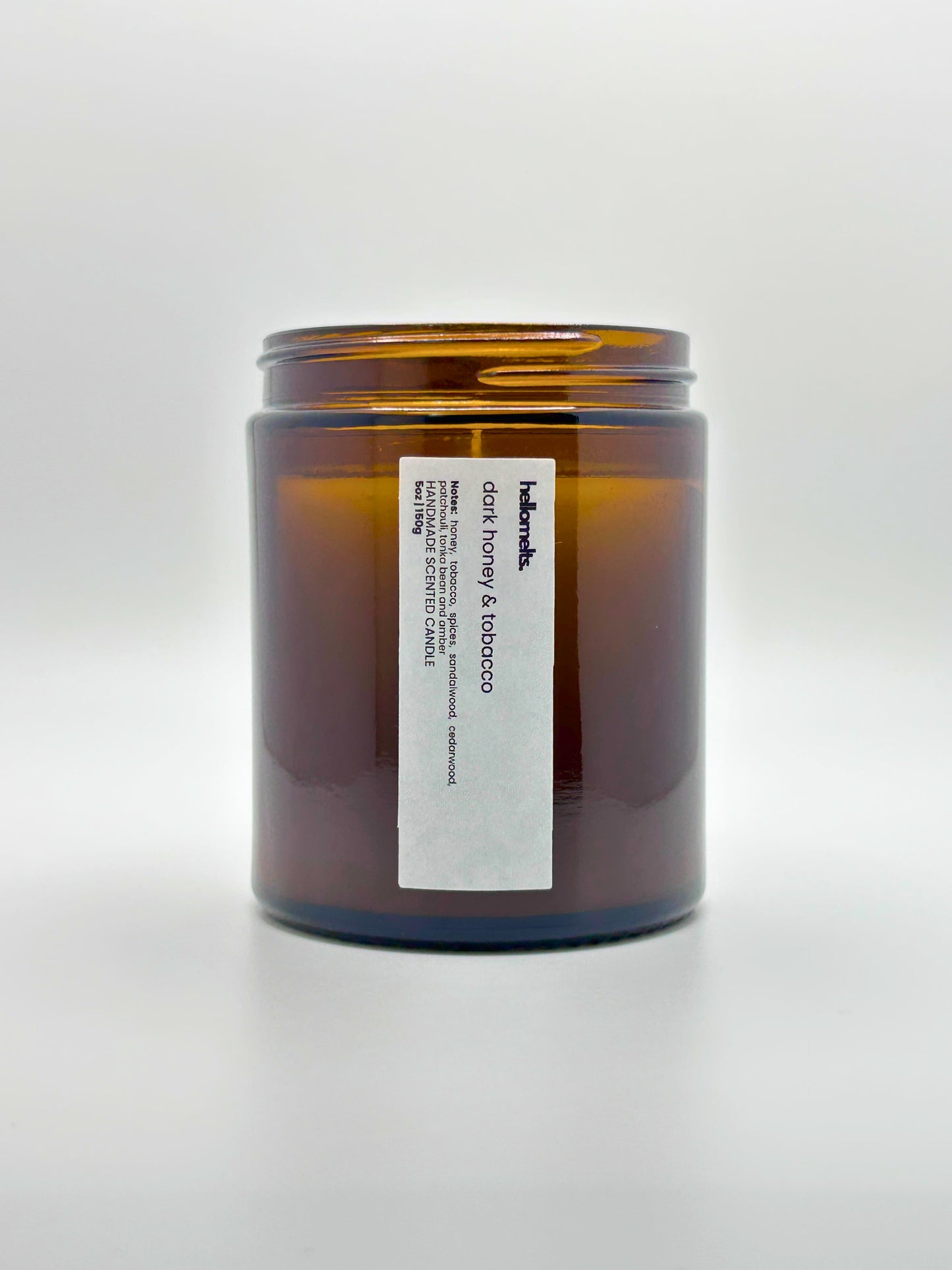 Front view of Dark Honey & Tobacco autumn scented candle by Hellomelts with the lid off, part of the Autumn Collection