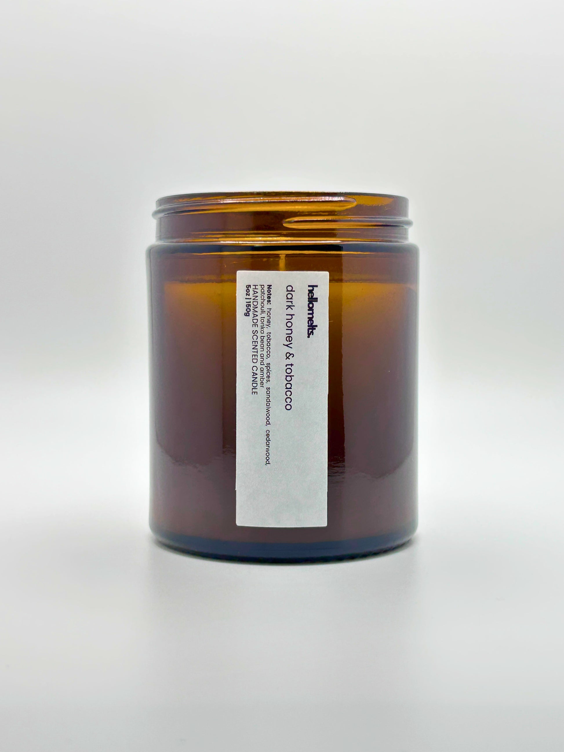 Front view of Dark Honey & Tobacco autumn scented candle by Hellomelts with the lid off, part of the Autumn Collection
