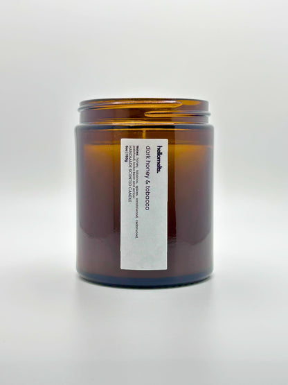 Front view of Dark Honey & Tobacco autumn scented candle by Hellomelts with the lid off, part of the Autumn Collection