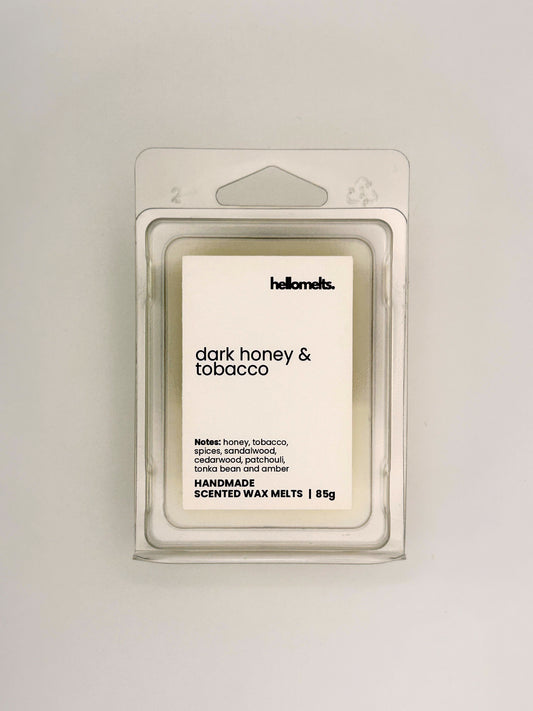 Front view of Dark Honey & Tobacco 85g wax melt in clear clamshell packaging from the Hellomelts Autumn Collection