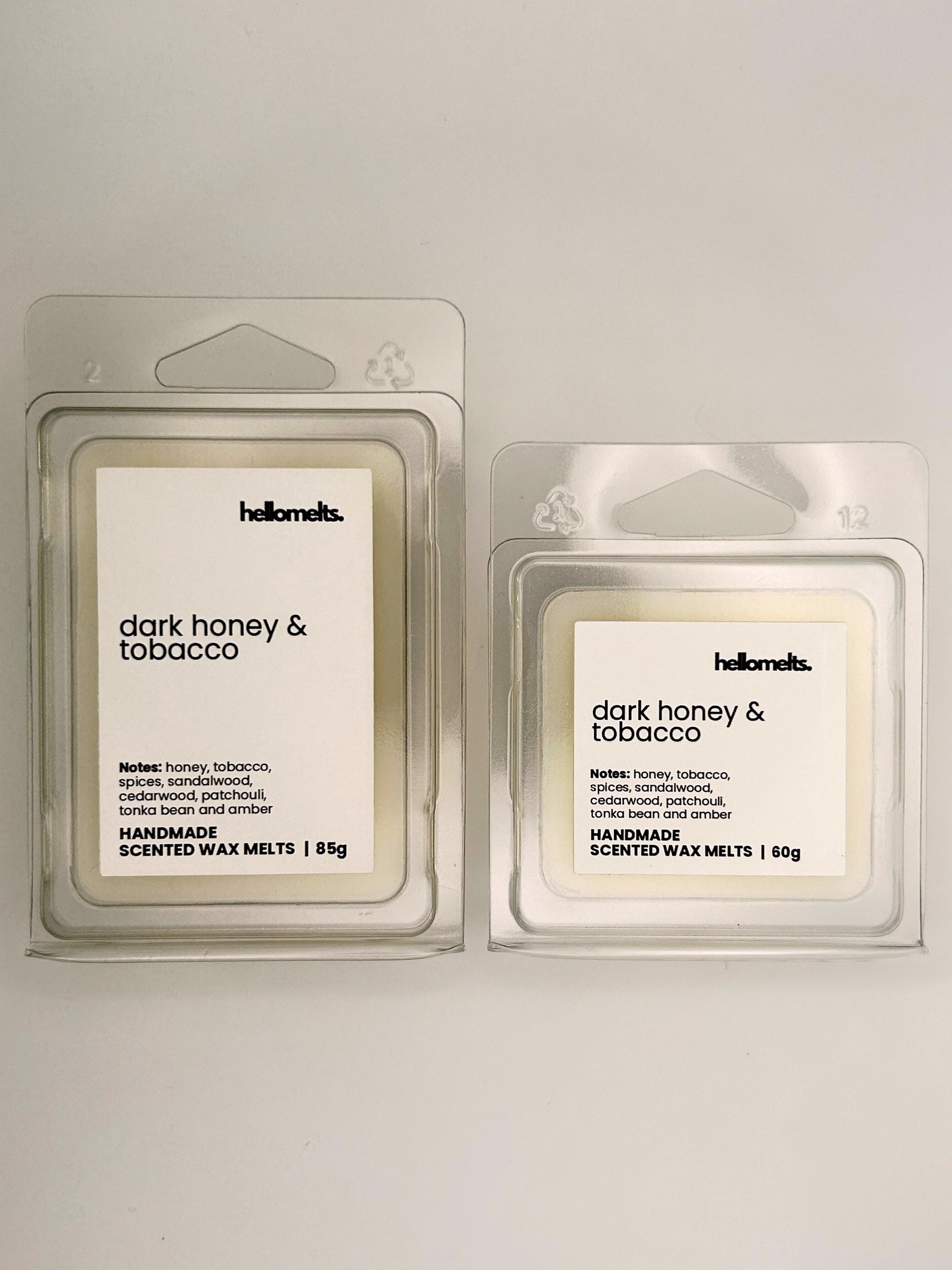 Dark Honey & Tobacco wax melts in 60g and 85g clamshells shown side by side from the Hellomelts Autumn Collection