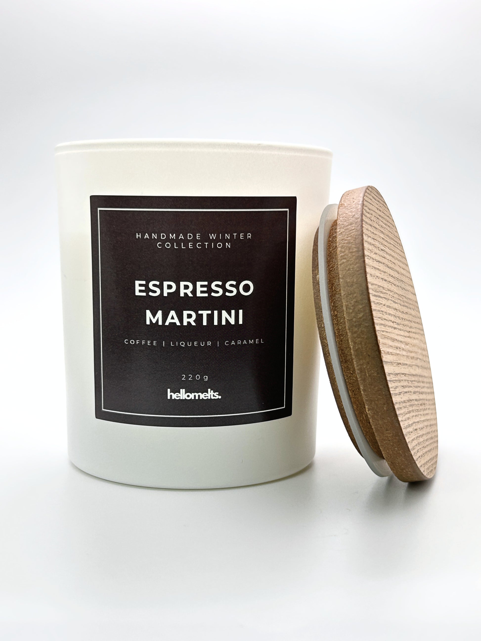 Espresso Martini 220g candle front-facing studio shot with the wooden lid positioned at the side, part of the Hellomelts Winter Collection