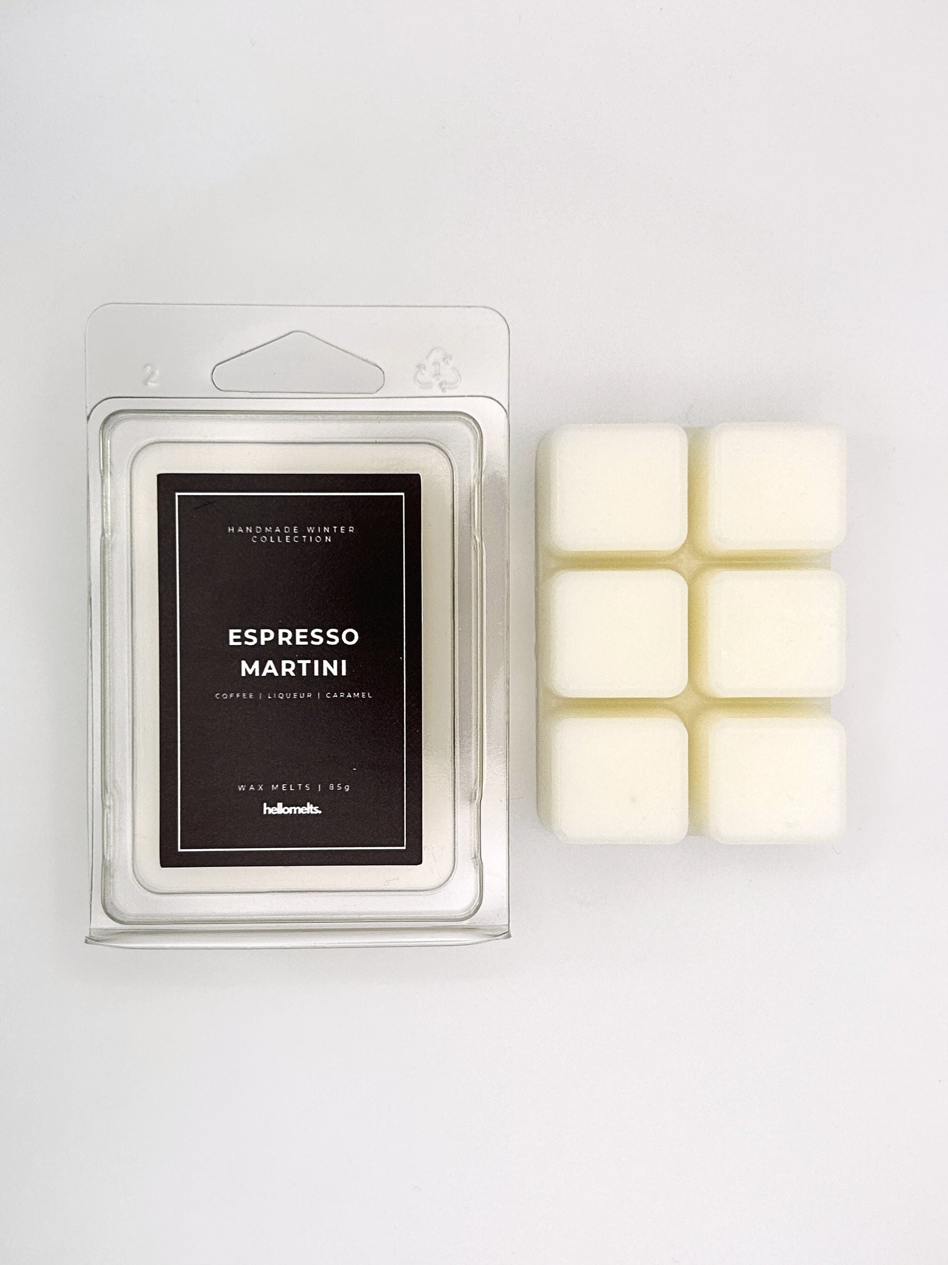 Espresso Martini 85g wax melt clamshell placed beside six wax cubes from the Hellomelts Winter Collection