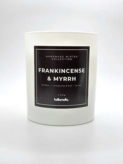 Frankincense & Myrrh 220g candle front-facing studio shot without the lid, showing the clean white jar and label from the Hellomelts Winter Collection