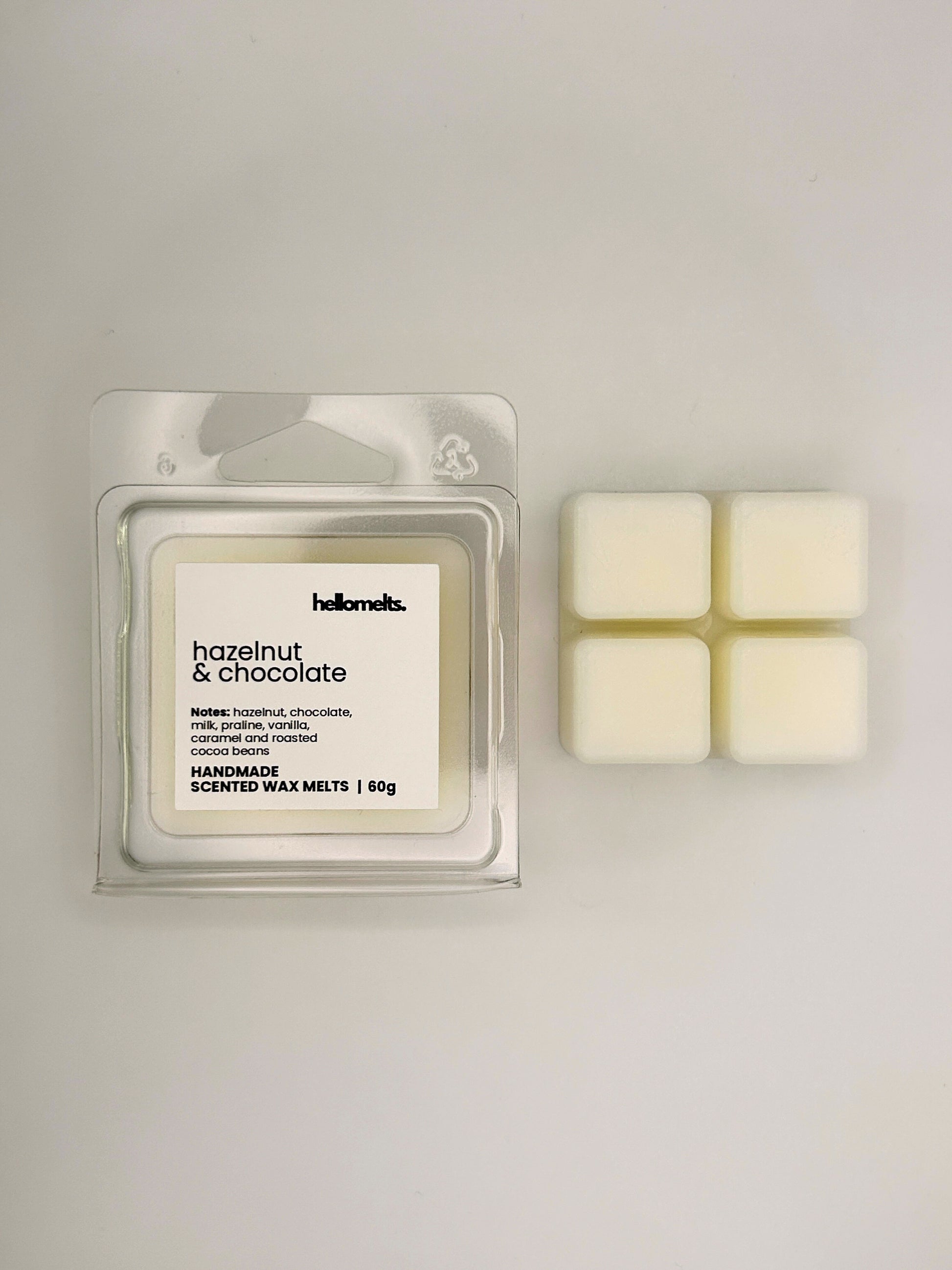 Hazelnut & Chocolate 60g wax melt bar displayed beside its clear clamshell packaging from the Hellomelts Autumn Collection