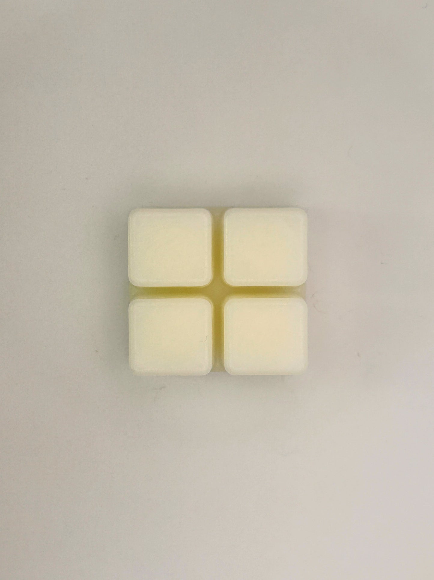 Flatlay of Hazelnut & Chocolate 60g wax melt bar on a light background from the Hellomelts Autumn Collection