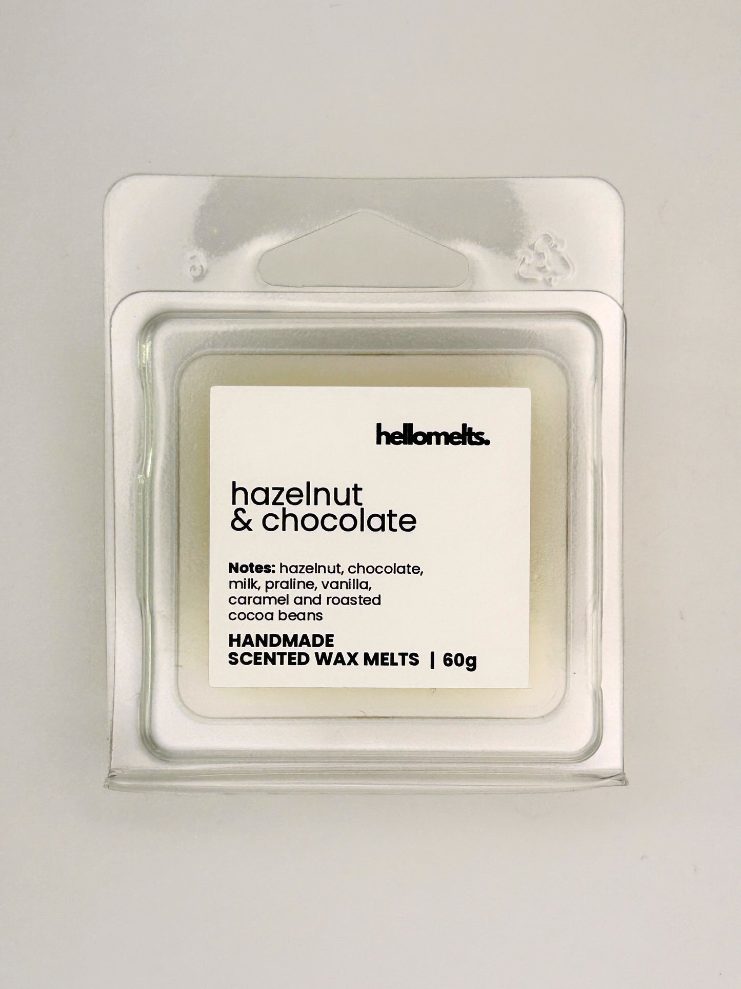 Close up of Hazelnut & Chocolate 60g wax melt label on clear clamshell packaging from the Hellomelts Autumn Collection