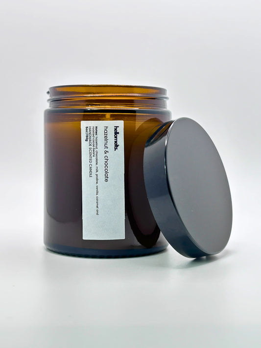 Front view of Hazelnut & Chocolate autumn scented candle by Hellomelts with the lid placed beside it, part of the Autumn Collection