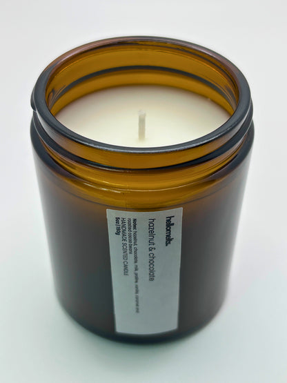 Angled top-down view of Hazelnut & Chocolate autumn candle by Hellomelts, highlighting the wick and hand-poured wax, part of the Autumn Collection