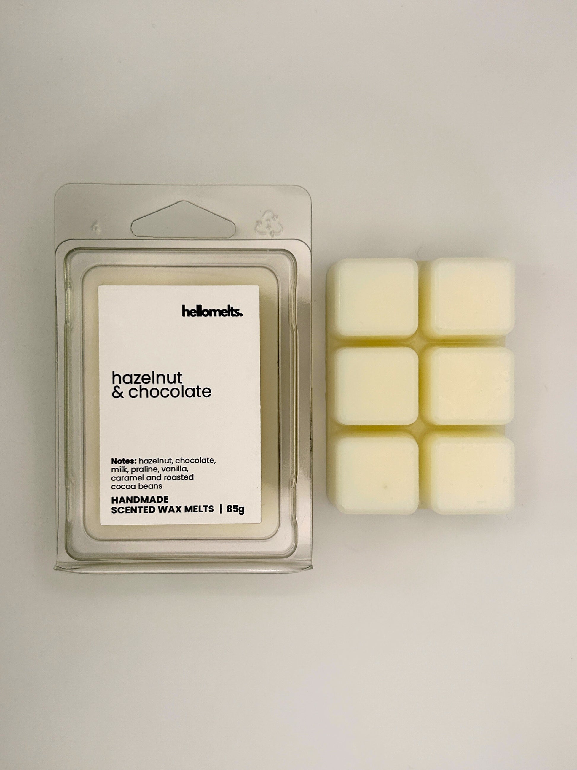 Hazelnut & Chocolate 85g wax melt bar displayed beside its clear clamshell packaging from the Hellomelts Autumn Collection