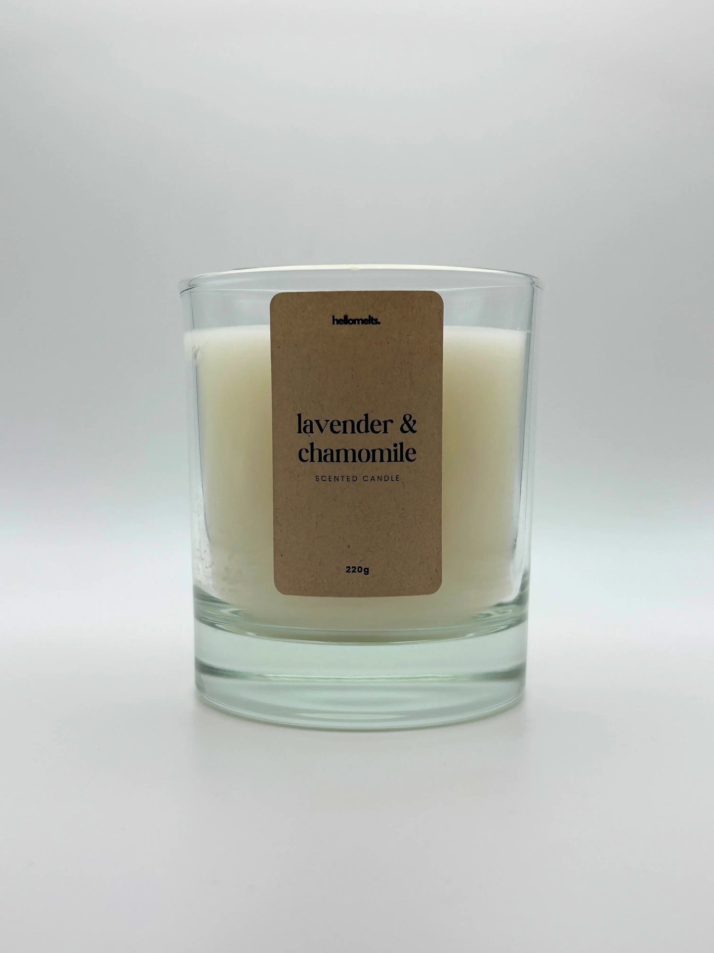 Front view of Lavender & Chamomile scented candle by Hellomelts, featuring a clean white wax in a clear glass jar, part of the Spring Collection.