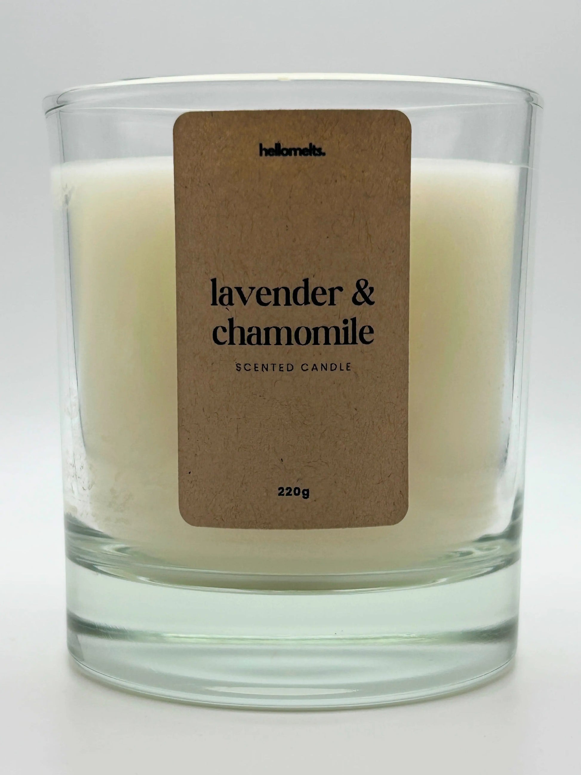 Close-up of the Lavender & Chamomile candle label showing scent name and weight, a handcrafted candle by Hellomelts for the Spring Collection.