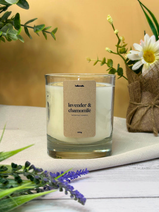Lavender & Chamomile scented candle by Hellomelts, shown in a soft indoor spring setting with lavender and chamomile flowers, highlighting the calming and gentle character of this Spring Collection fragrance