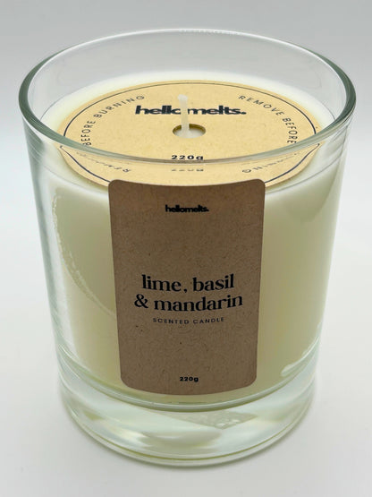 Angled front view of the Lime, Basil & Mandarin candle with the branded cardboard wick cover on, from the Hellomelts Spring Collection.