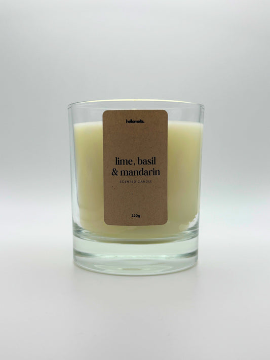 Front view of Lime, Basil & Mandarin scented candle by Hellomelts, featuring a clean off-white wax in a clear glass jar, part of the Spring Collection.