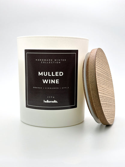 Mulled Wine 220g candle front-facing studio shot with the wooden lid positioned at the side, part of the Hellomelts Winter Collection
