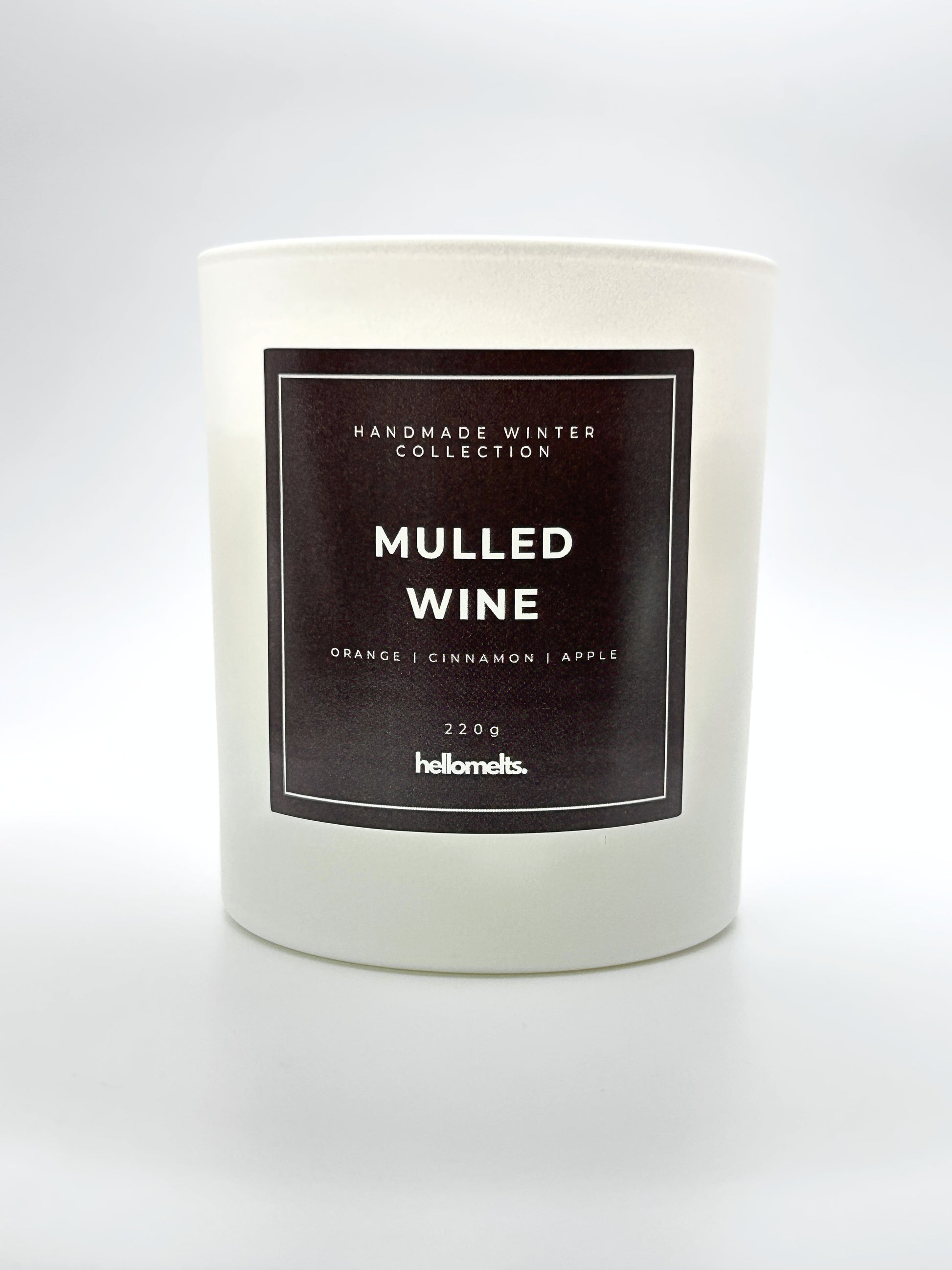 Mulled Wine 220g candle front-facing studio shot without the lid, showing the clean white jar and label from the Hellomelts Winter Collection