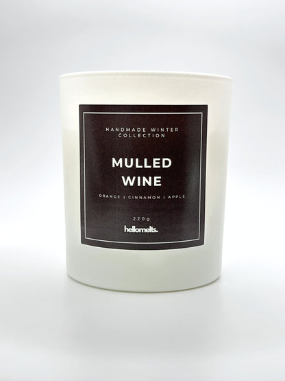 Mulled Wine 220g candle front-facing studio shot without the lid, showing the clean white jar and label from the Hellomelts Winter Collection
