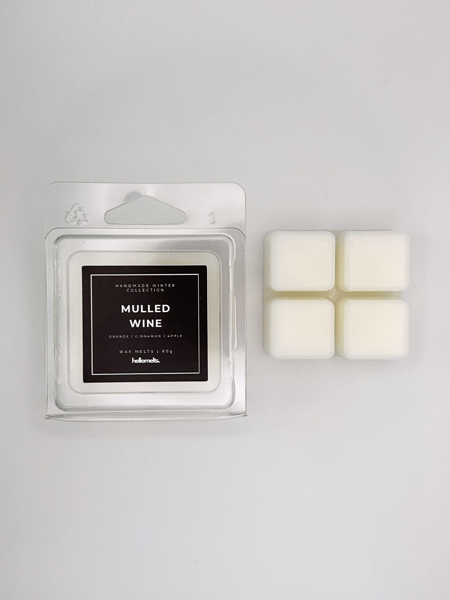 Mulled Wine 60g wax melt clamshell placed beside four wax cubes from the Hellomelts Winter Collection