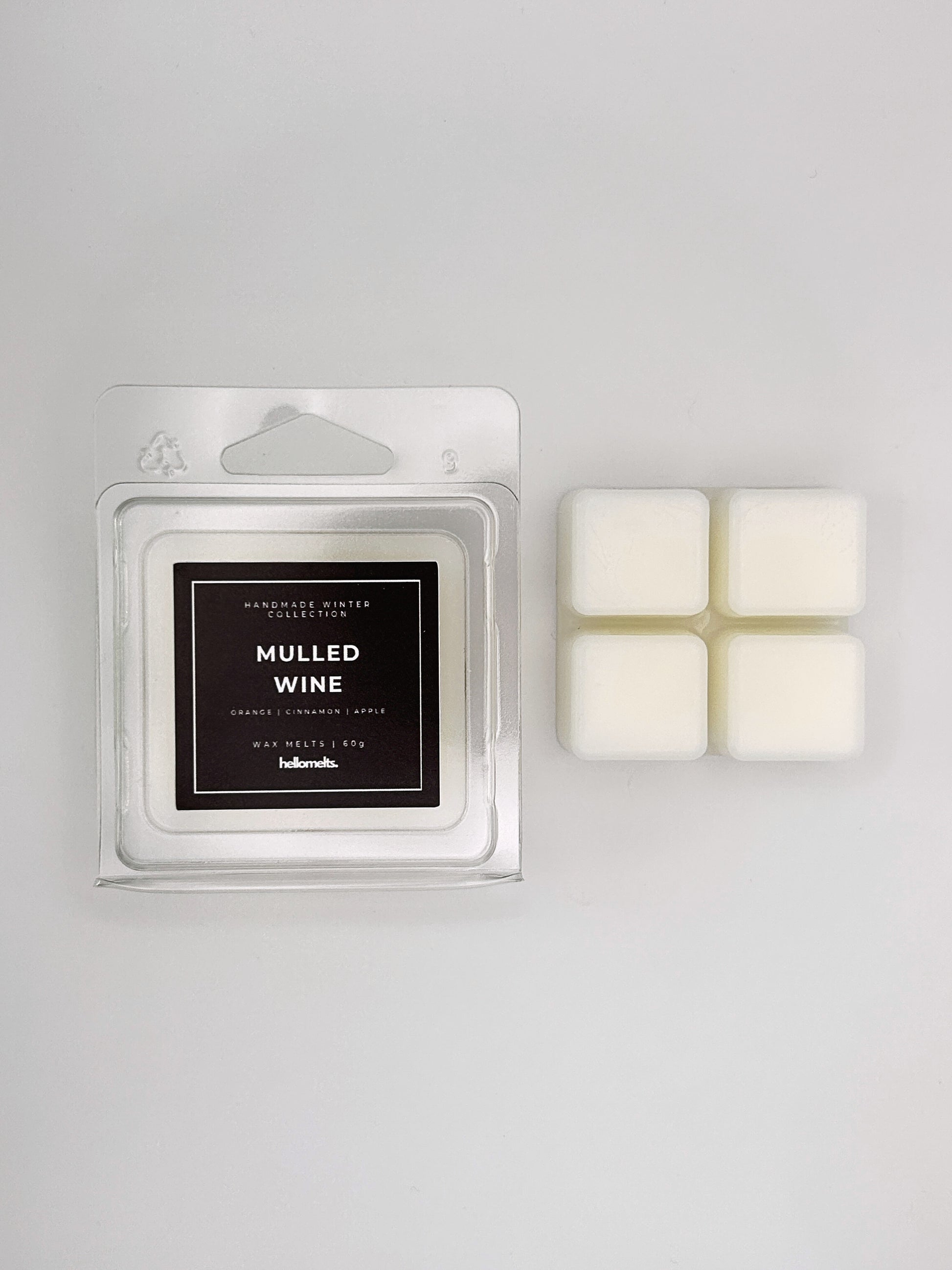 Mulled Wine 60g wax melt clamshell placed beside four wax cubes from the Hellomelts Winter Collection